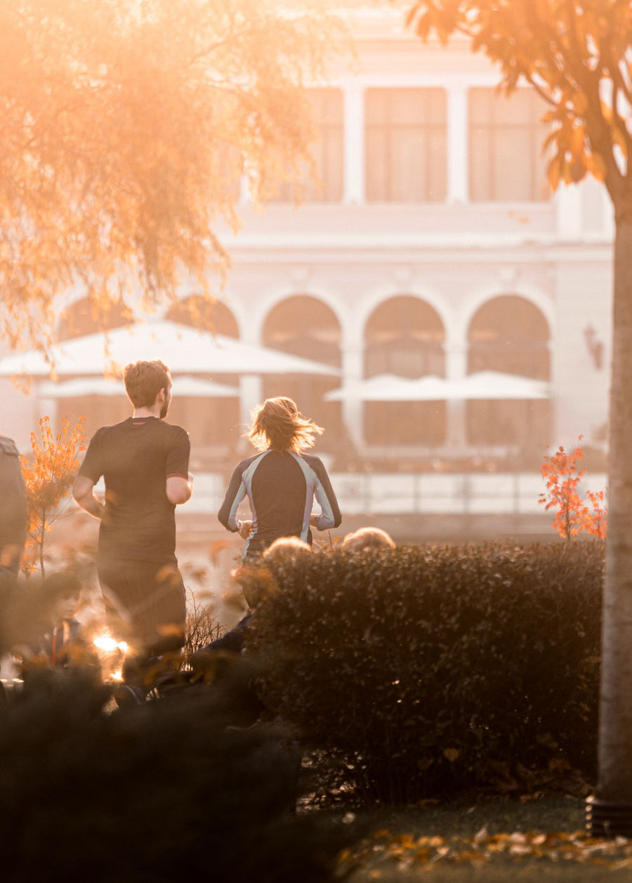 A couple jogging in a park