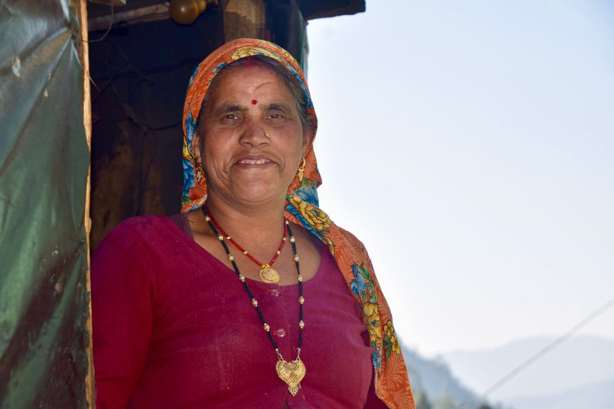 A smiling woman in traditional Indian dress