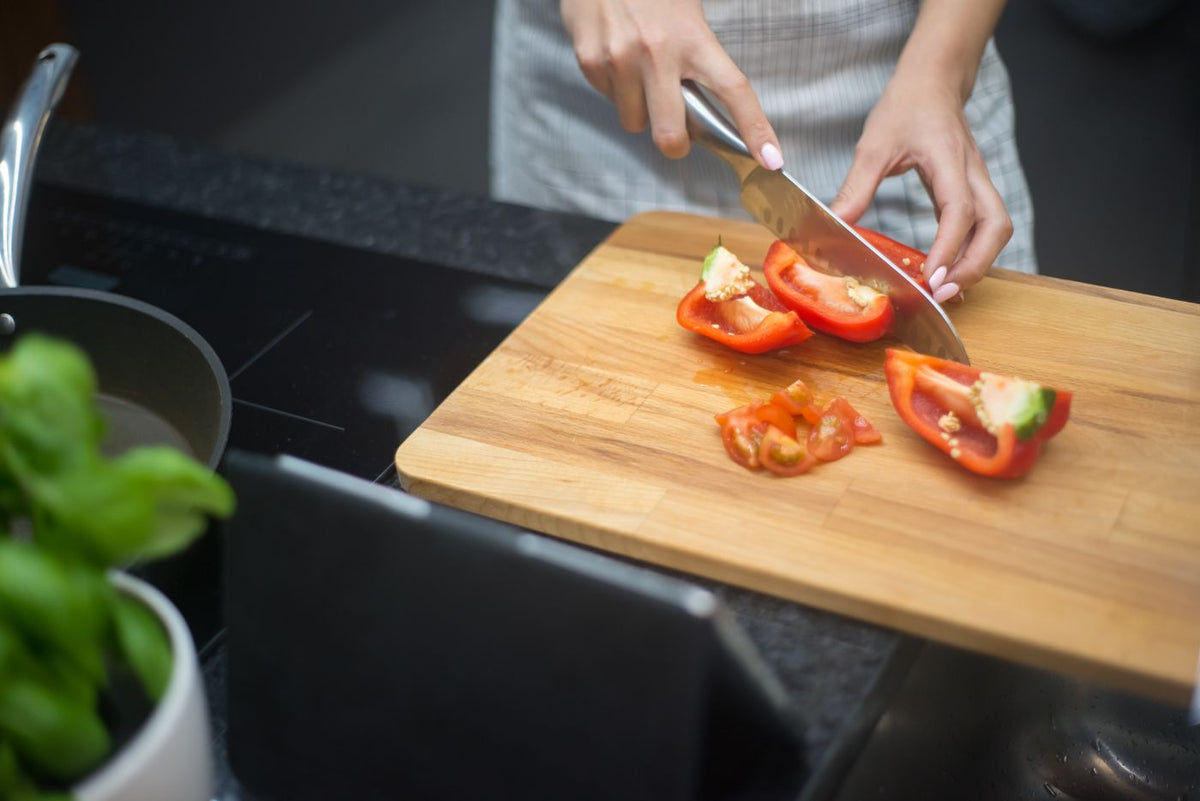 Slicing red pepper in a kitchen