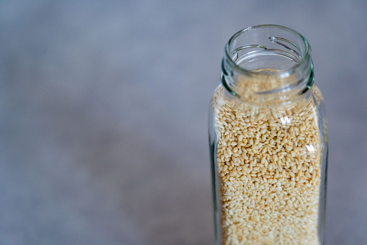 Sesame seeds (til) in a glass jar