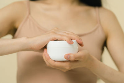 Applying moisturiser to the skin