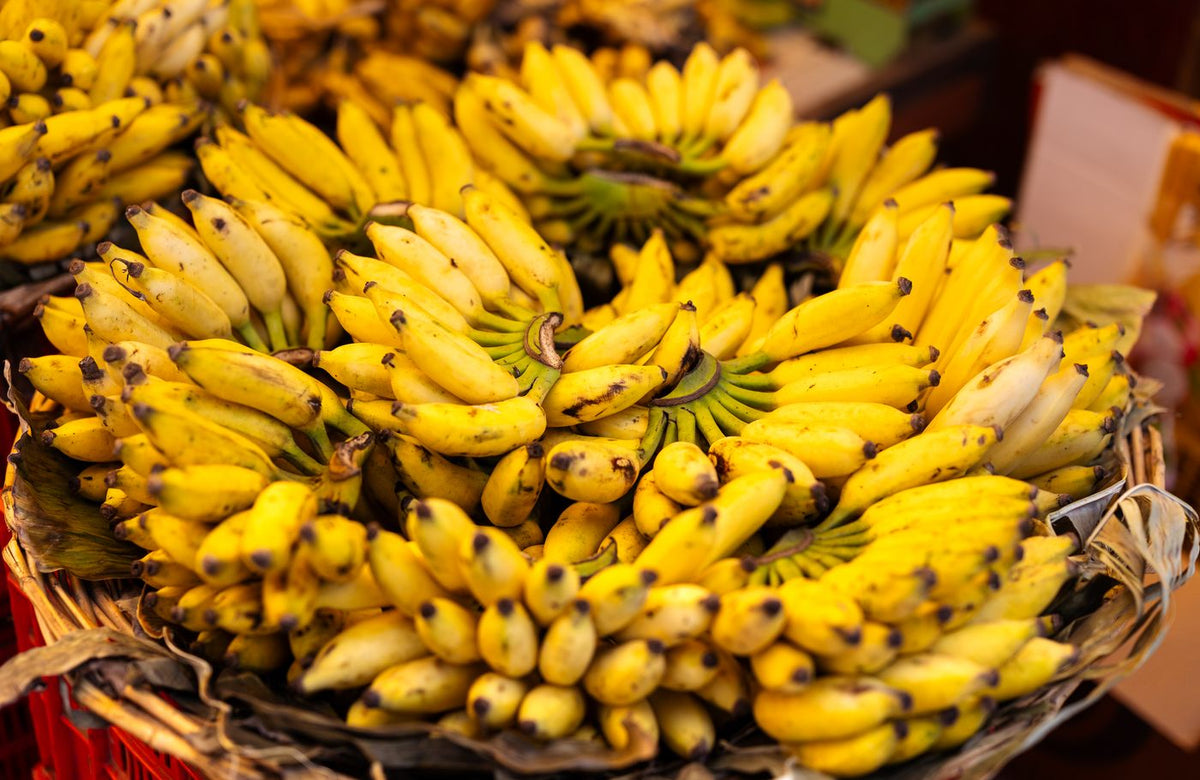 Bunches of yellow bananas at a market in Bengaluru