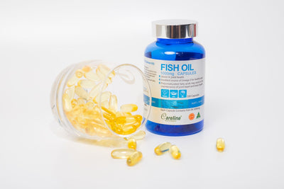 Fish oil capsules spilling out of a container