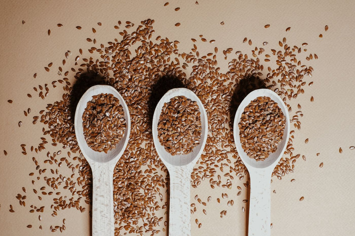 Flax seeds (alsi) in wooden spoons