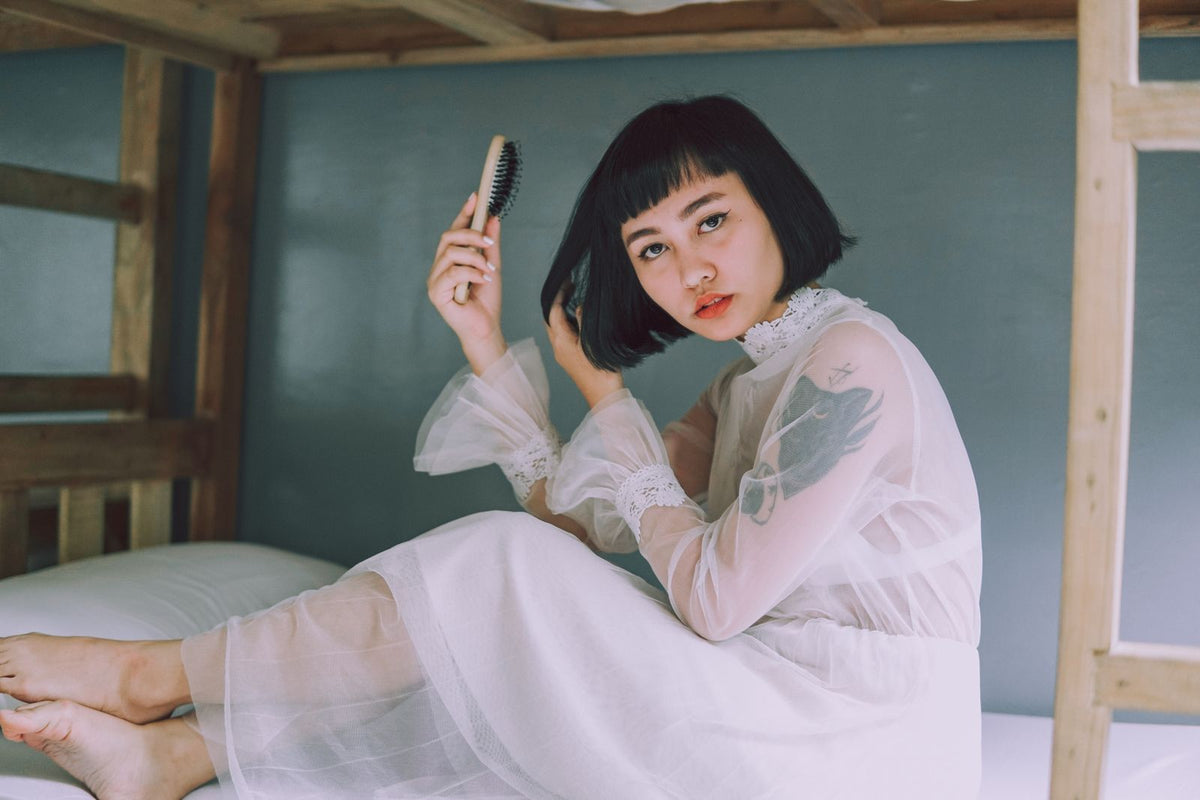 Woman holding a hair brush