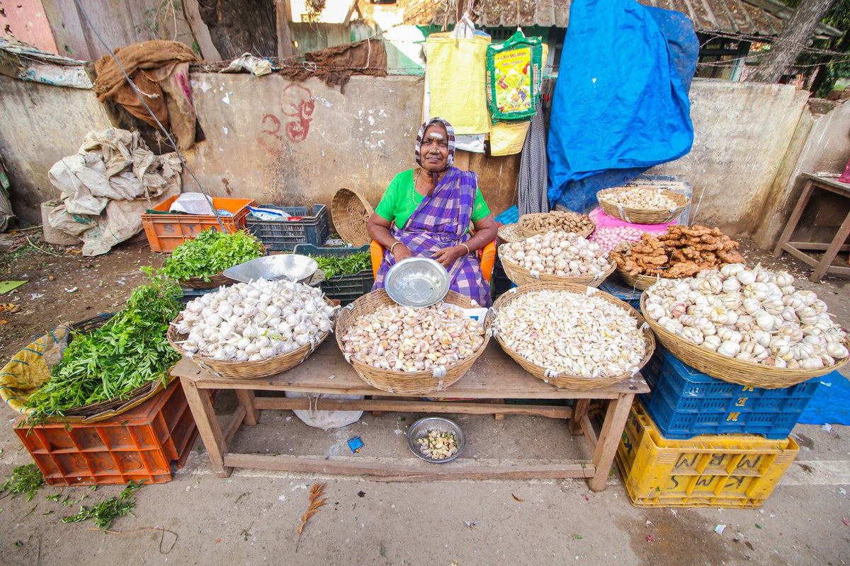 A vegetable vendor at a market in India