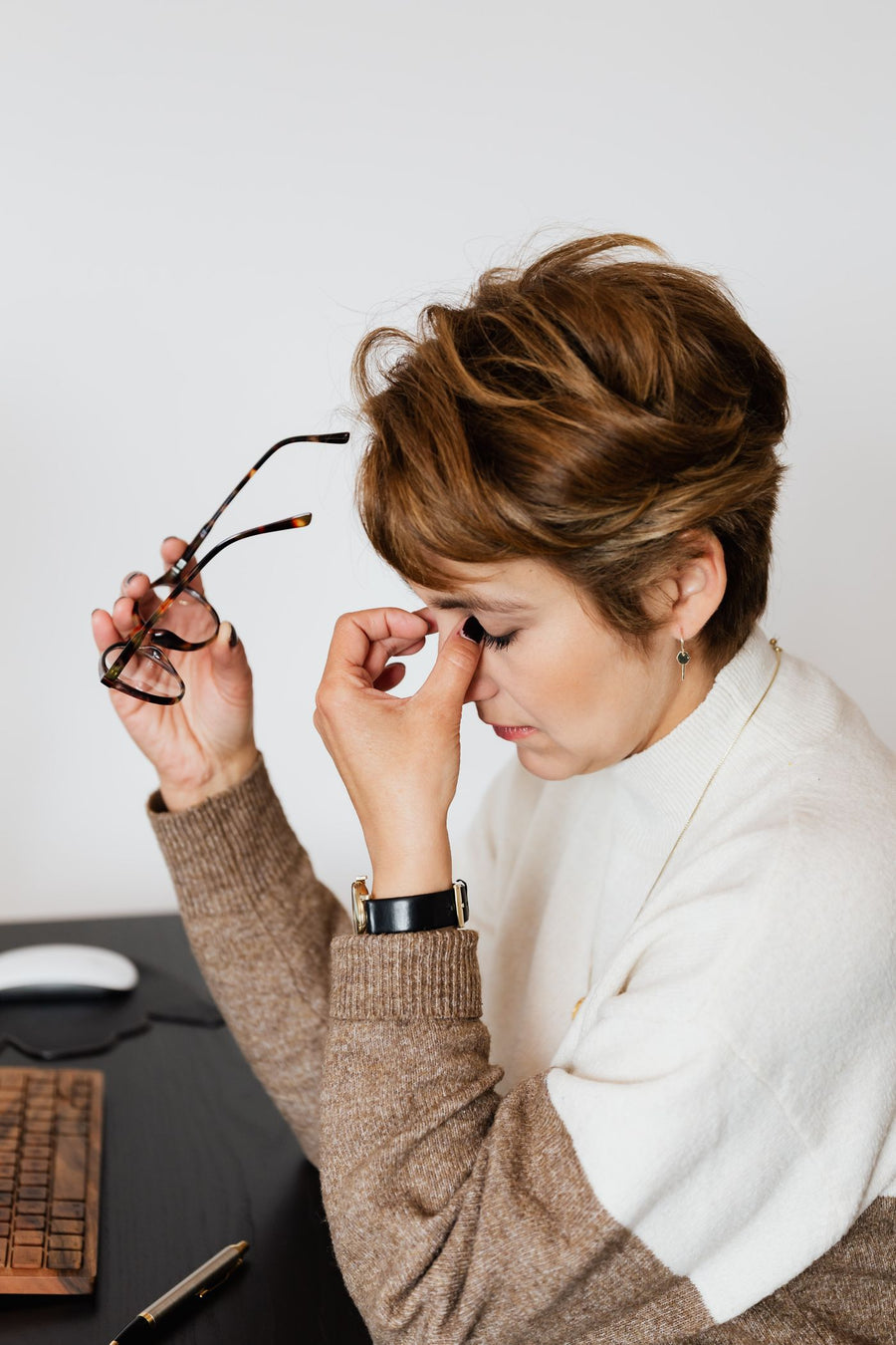 A stressed woman at her desk