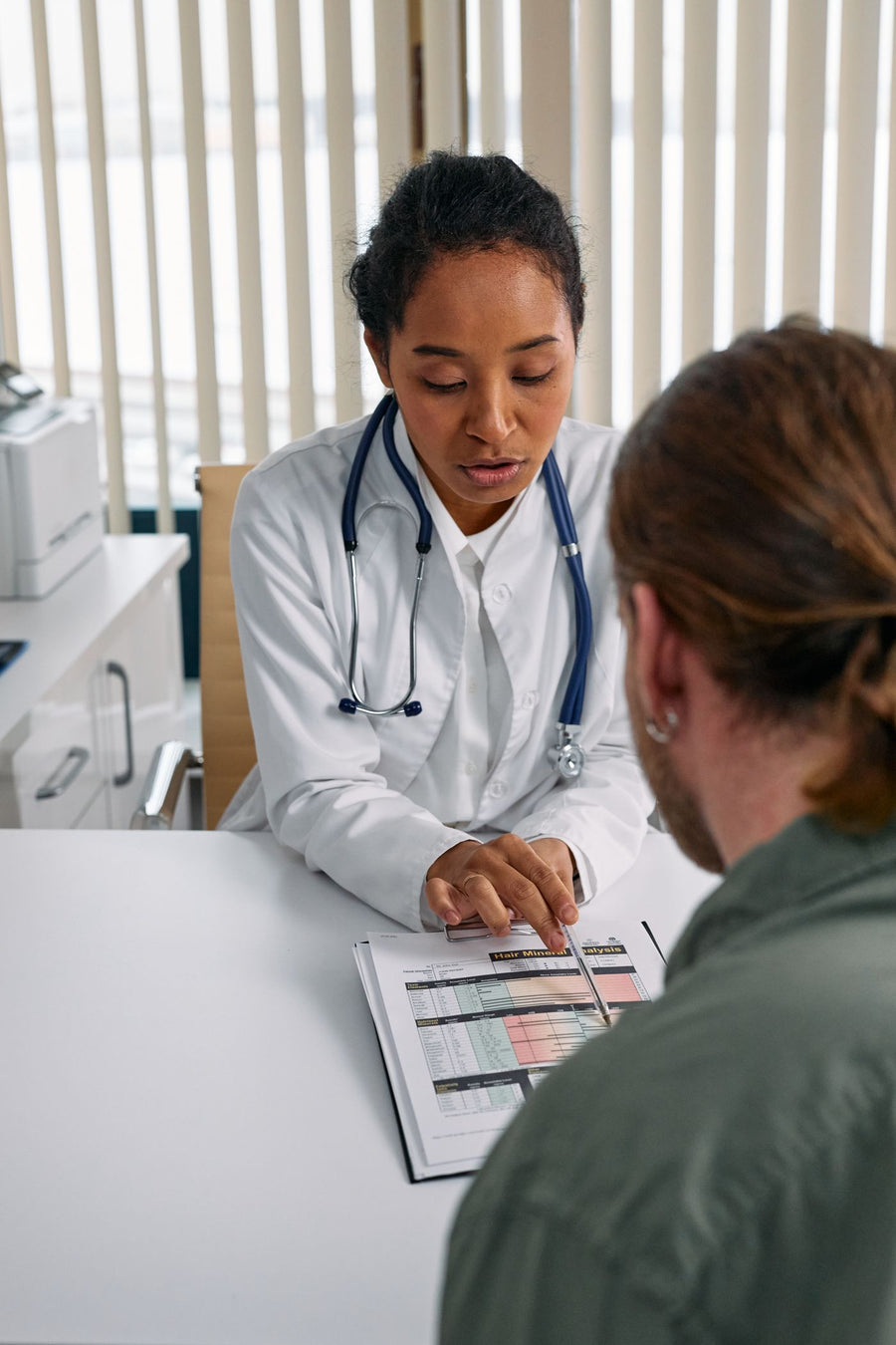 A doctor talking with a patient
