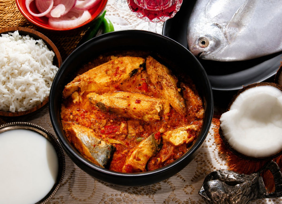 Indian fish curry served with steamed rice and coconut