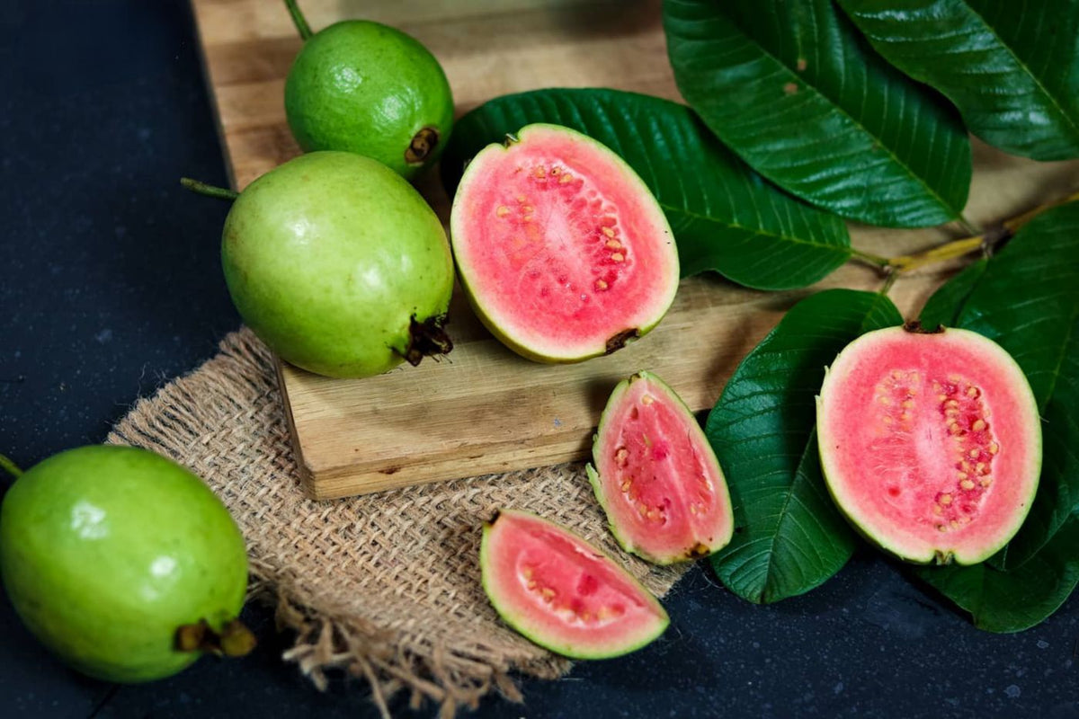 Fresh guavas, whole and sliced, a vitamin C rich fruit